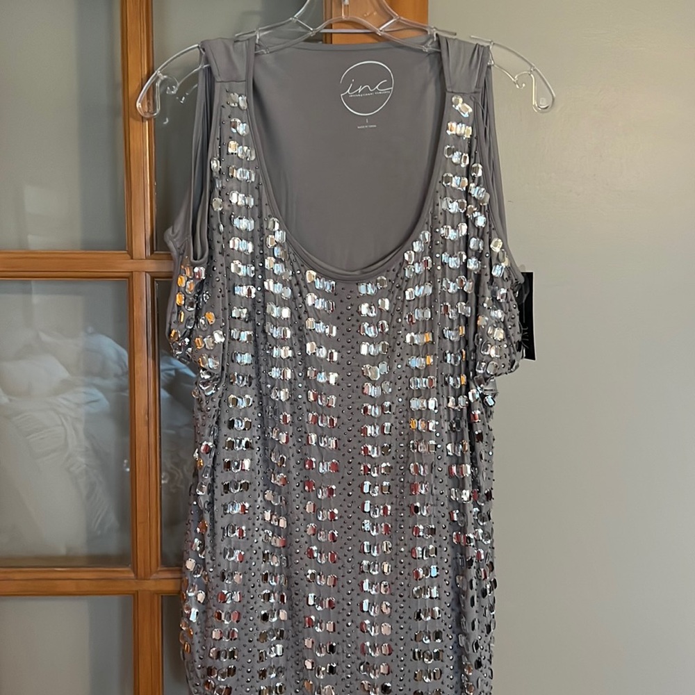 Sparkly silver top from Macy’s. International concepts, size extra-large.
